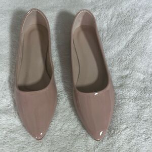 Nude, patent leather flats.